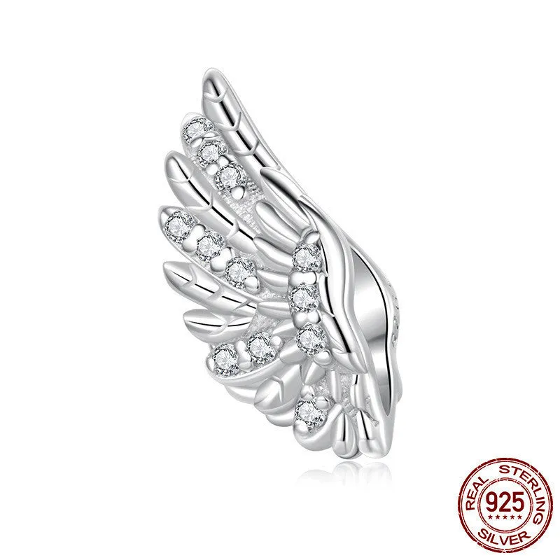 S925 sterling silver wing bead inlaid with zircon on a white background showing 1.4cm size