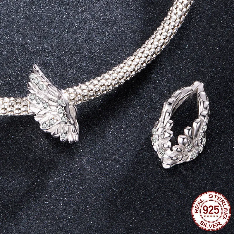S925 sterling silver wing bead inlaid with zircon on a white background showing 1.4cm size