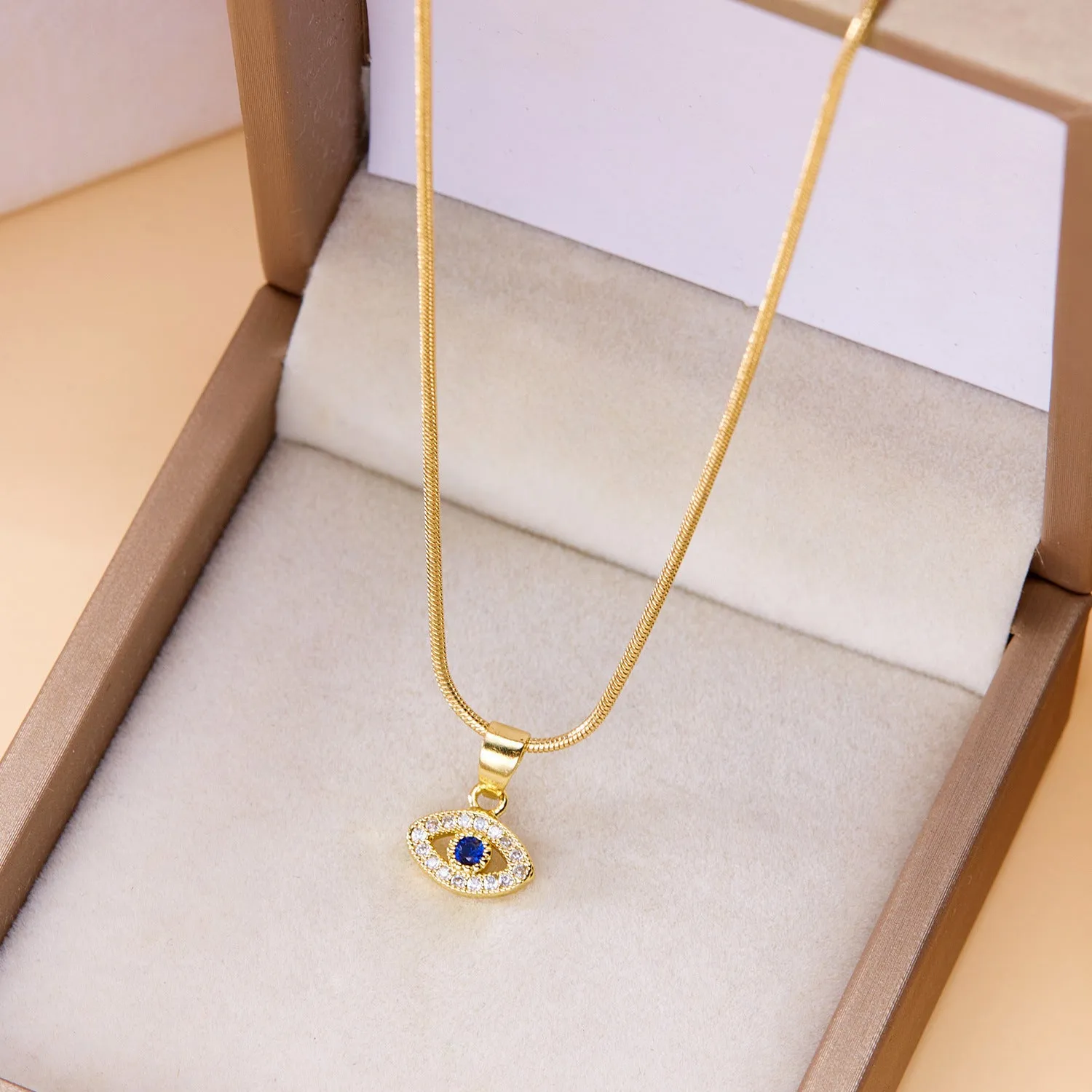 Blue eyes diamond devil's eye copper pendant necklace with electroplated finish on adjustable cross chain