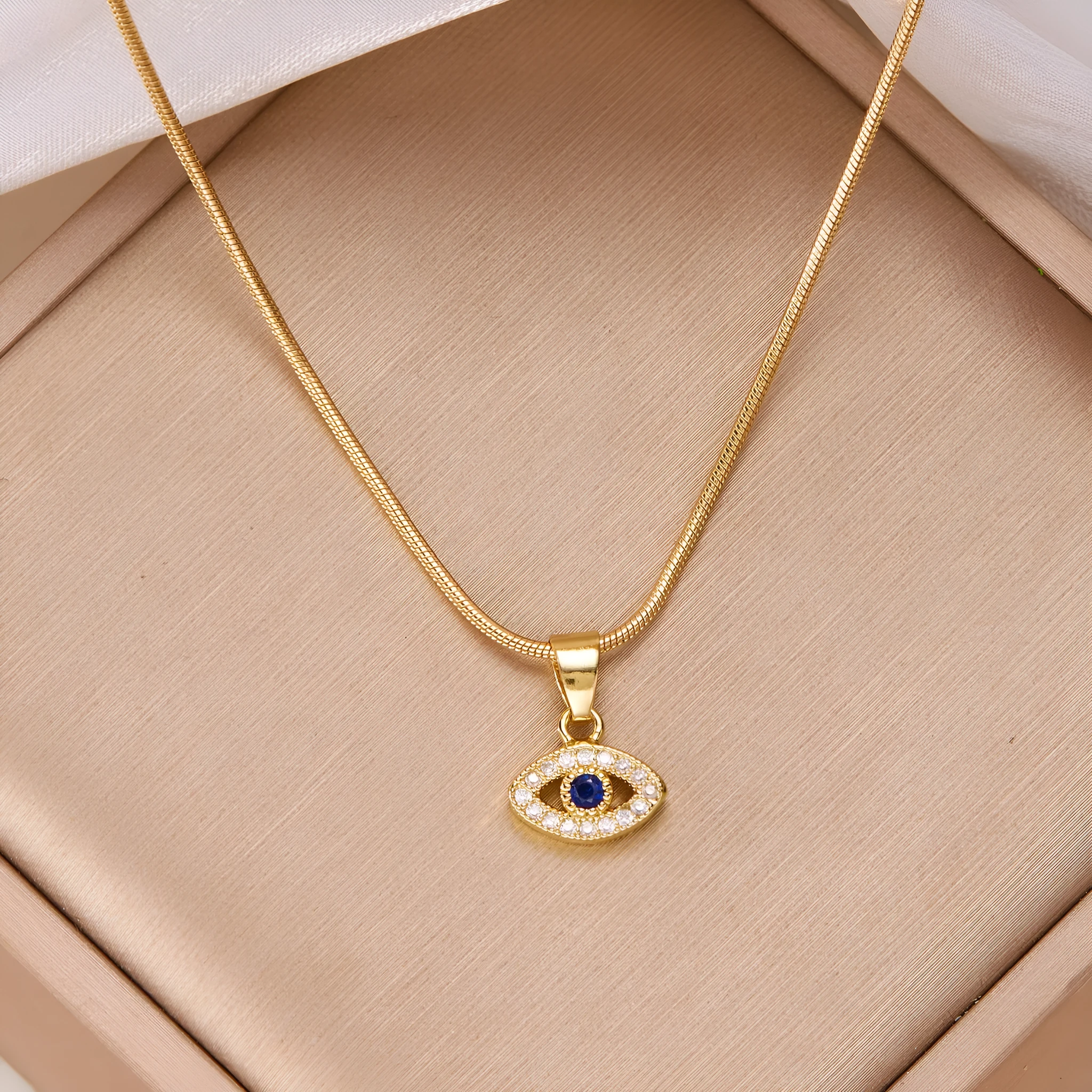 Blue eyes diamond devil's eye copper pendant necklace with electroplated finish on adjustable cross chain