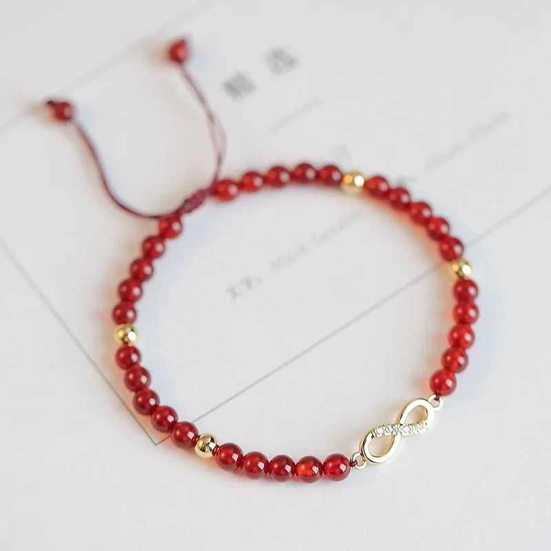 Hand-woven natural red agate bracelet showing diamond-shaped beads in ethnic woven pattern