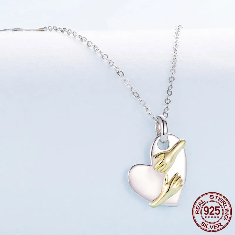 Original Hug Love 925 sterling silver heart necklace with adjustable O-ring chain on white background