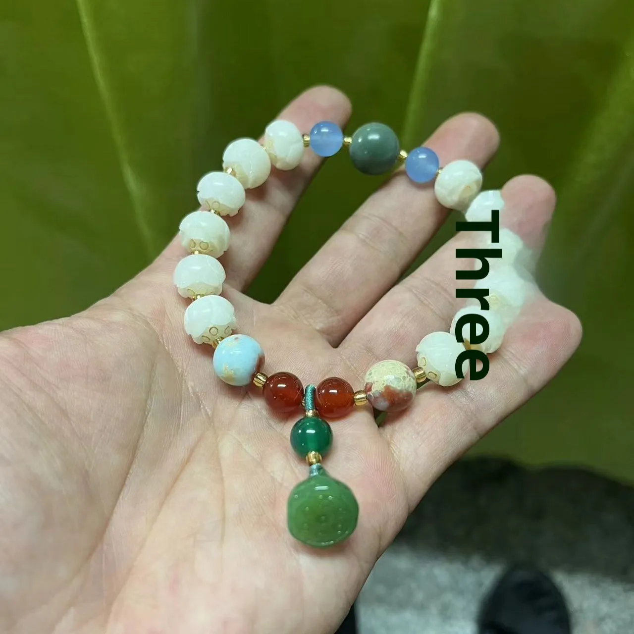 Carved bodhi root and white jade pumpkin lotus beads bracelet with cat's paw pendant.