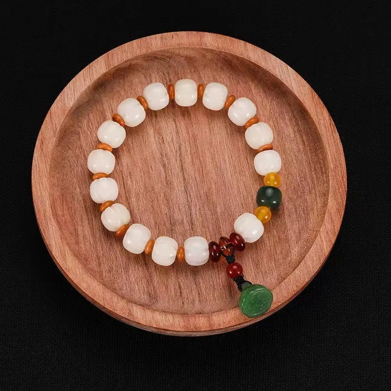 Carved bodhi root and white jade pumpkin lotus beads bracelet with cat's paw pendant.