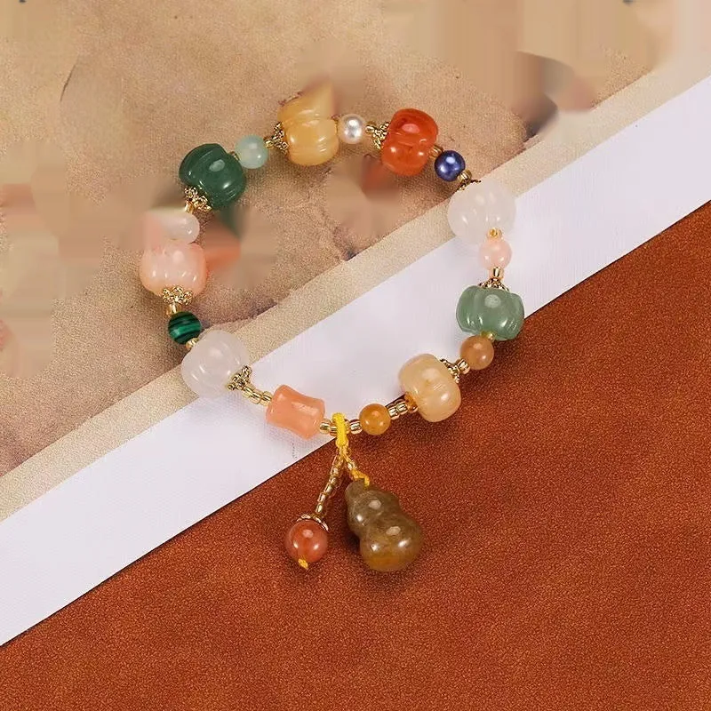 Carved bodhi root and white jade pumpkin lotus beads bracelet with cat's paw pendant.