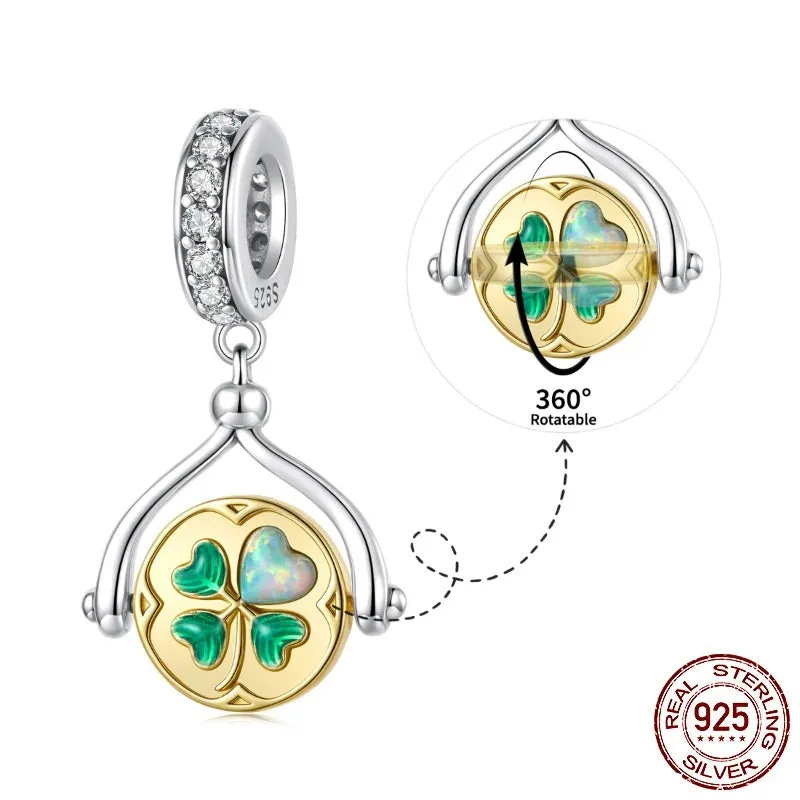 925 silver rotating card pendant with four-leaf clover pattern and wing element on white background