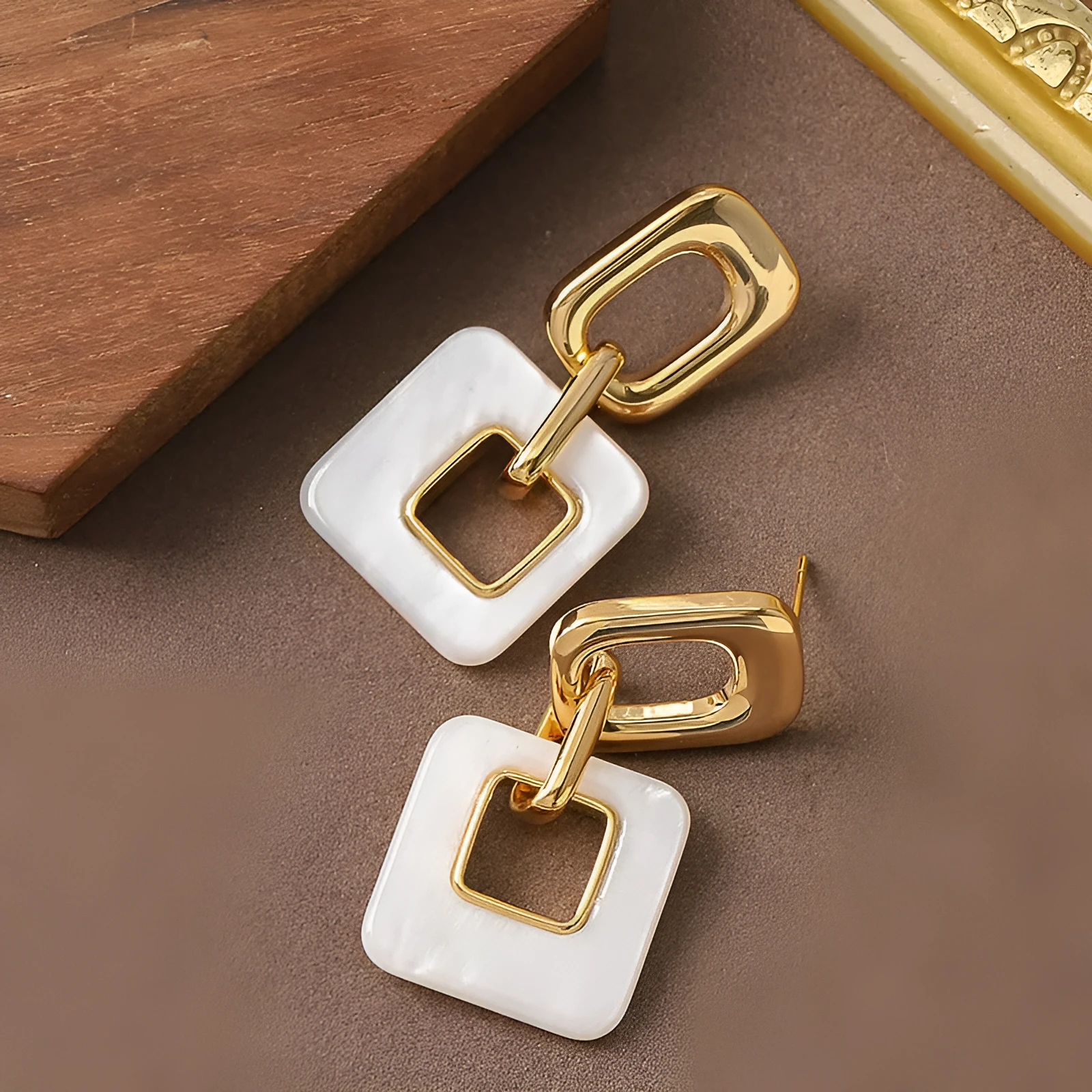 Hollow geometric square earrings with chamfered pattern in electroplated copper