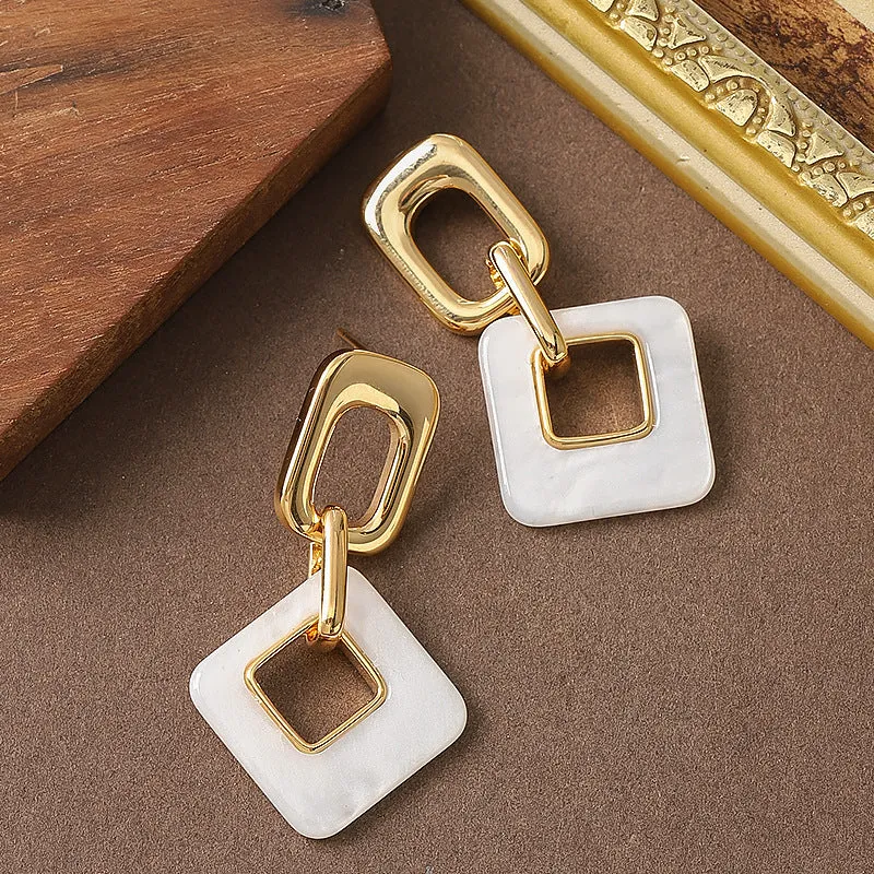 Hollow geometric square earrings with chamfered pattern in electroplated copper