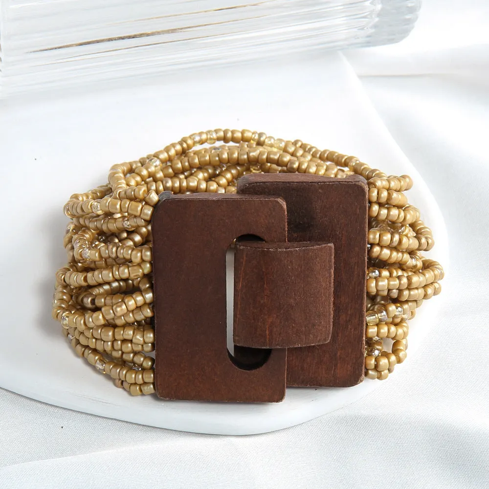 Handmade multi-layer elastic bracelet with rice-shaped glass and coloured glaze beads in geometric quadrilateral pattern, six colour options