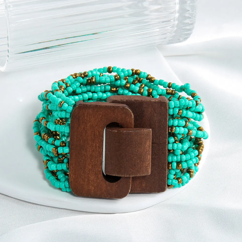 Handmade multi-layer elastic bracelet with rice-shaped glass and coloured glaze beads in geometric quadrilateral pattern, six colour options