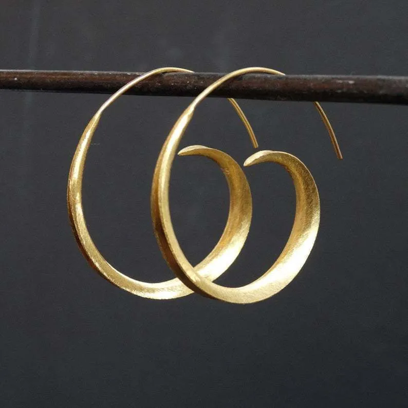 Round alloy ear studs with spiral leaf design in gold electroplated finish on white background