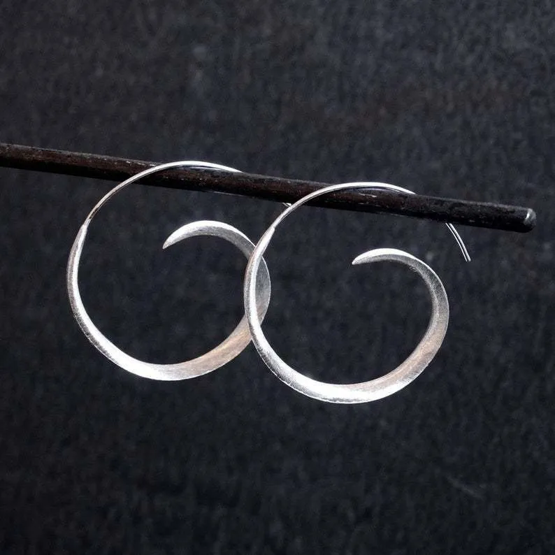 Round alloy ear studs with spiral leaf design in gold electroplated finish on white background
