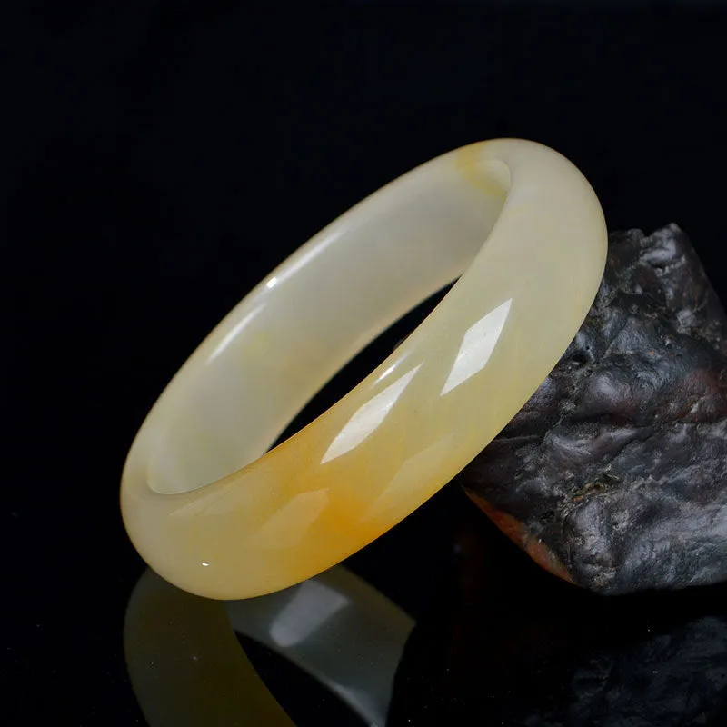 Natural light jade bracelet in traditional Chinese style with polished surface