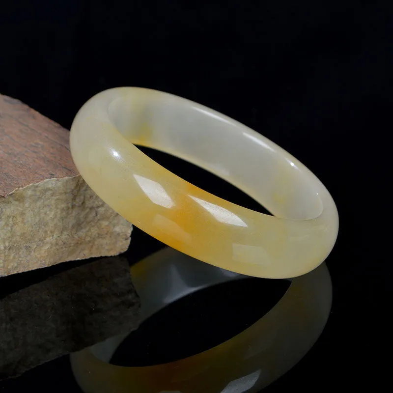 Natural light jade bracelet in traditional Chinese style with polished surface