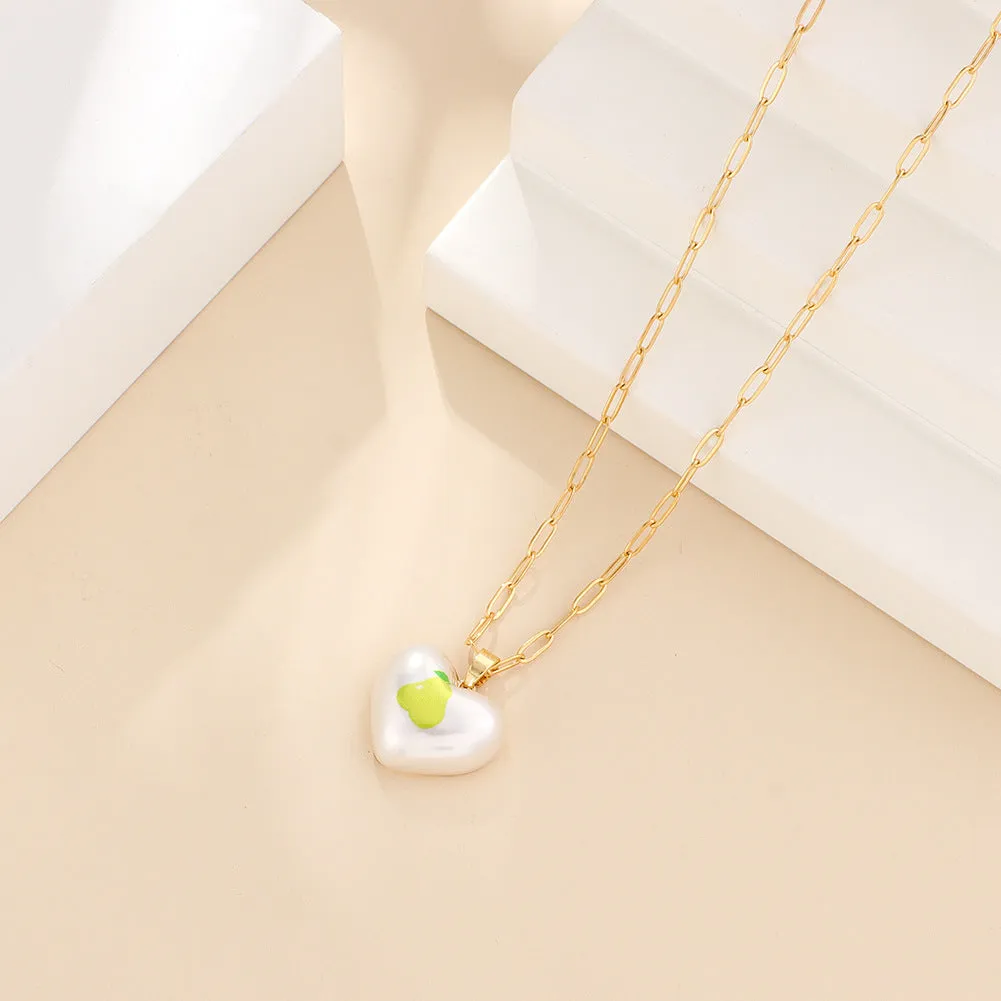 Heart-shaped necklace with geometric chain and a detailed fruit pendant charm, adjustable from 21cm to 50cm.