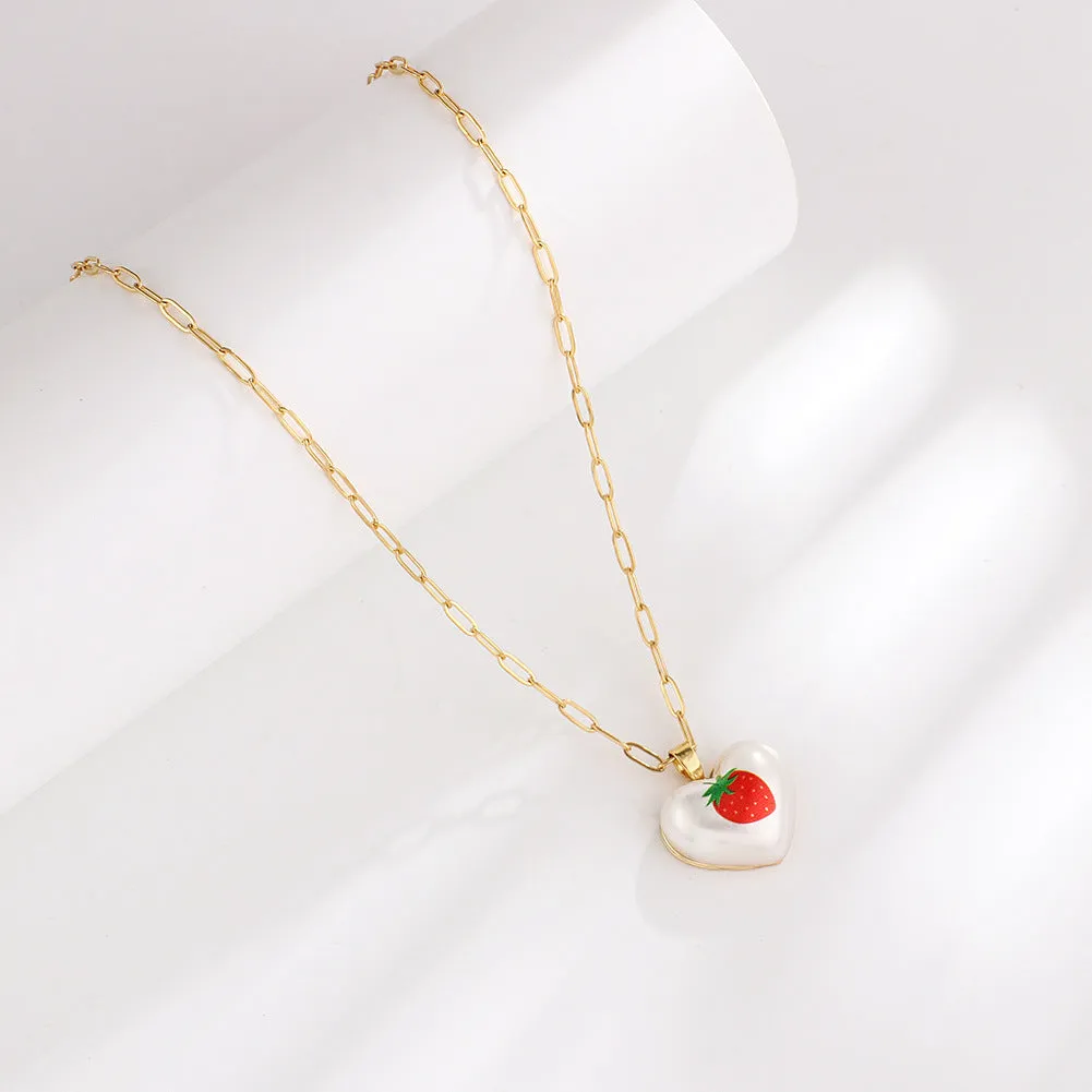 Heart-shaped necklace with geometric chain and a detailed fruit pendant charm, adjustable from 21cm to 50cm.