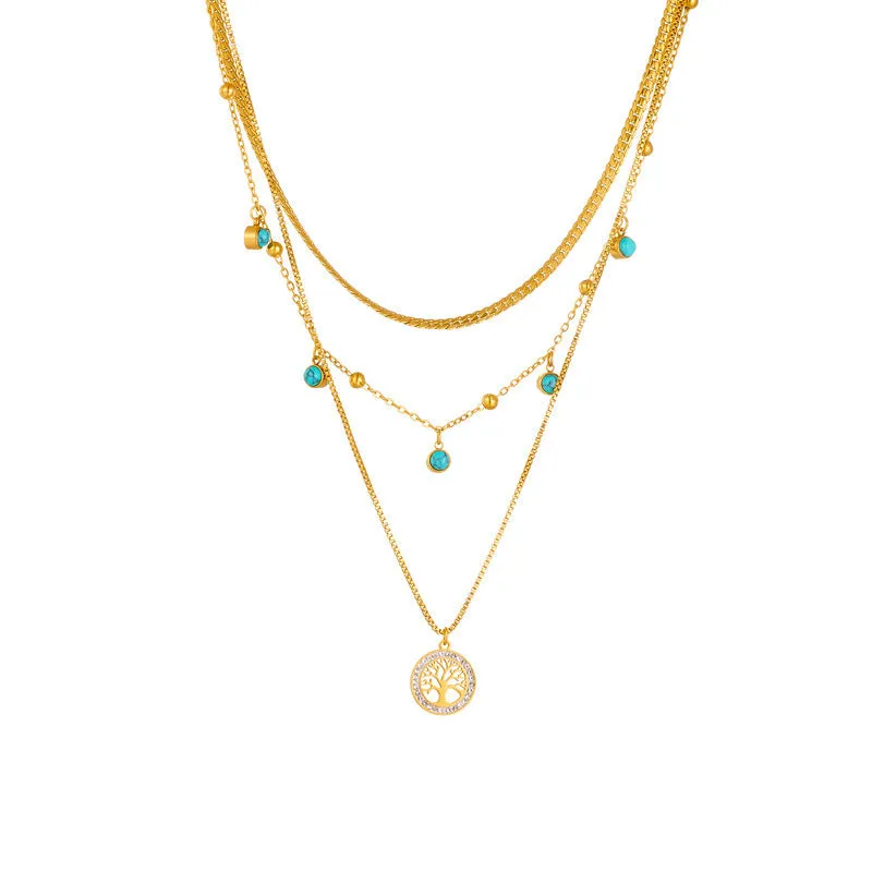 Gold-plated multi-layer stainless steel necklace with geometric tree pendant on woman