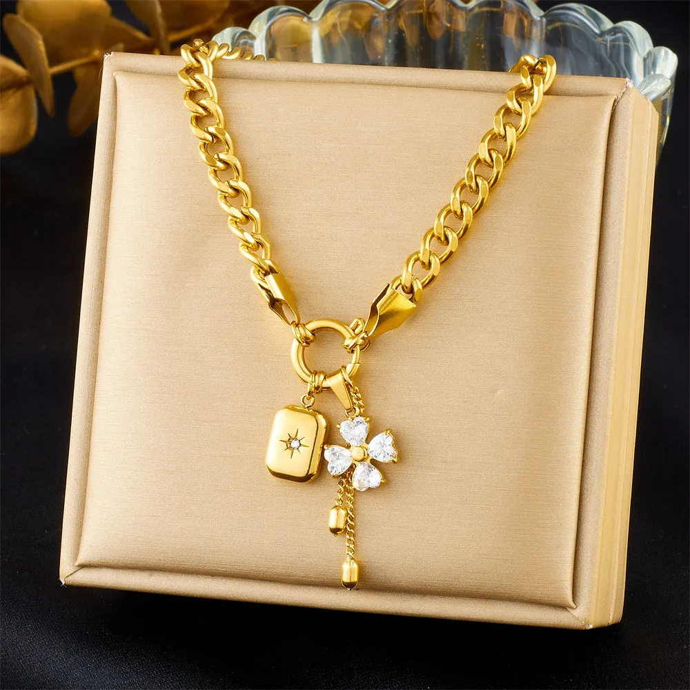 Tassel stainless steel bracelet and necklace set for women with flower and butterfly motifs on a white background