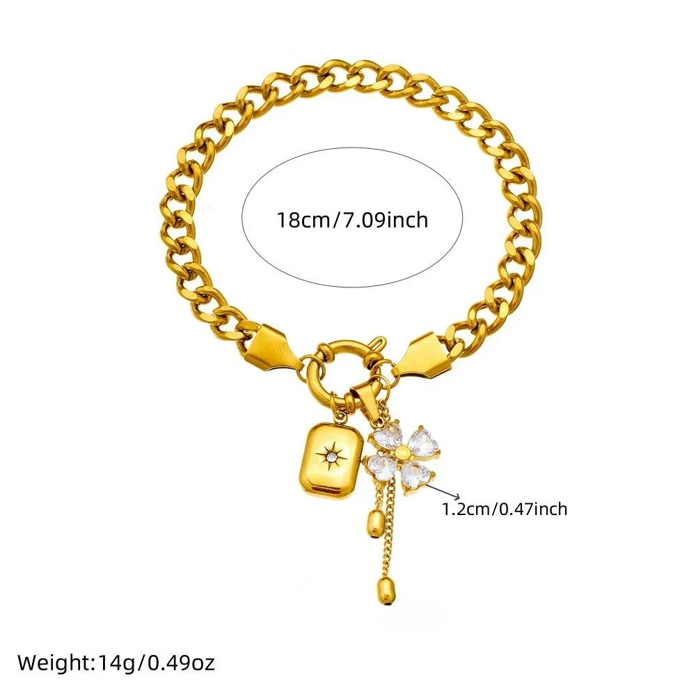 Tassel stainless steel bracelet and necklace set for women with flower and butterfly motifs on a white background