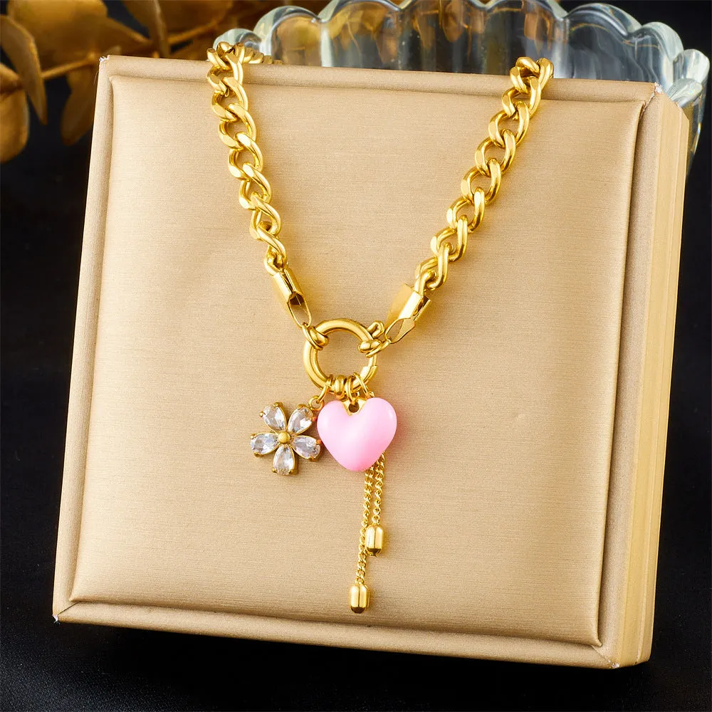 Tassel stainless steel bracelet and necklace set for women with flower and butterfly motifs on a white background