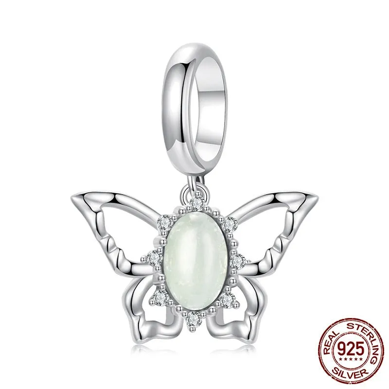 925 sterling silver butterfly pendant with green natural jade inlay on a white background