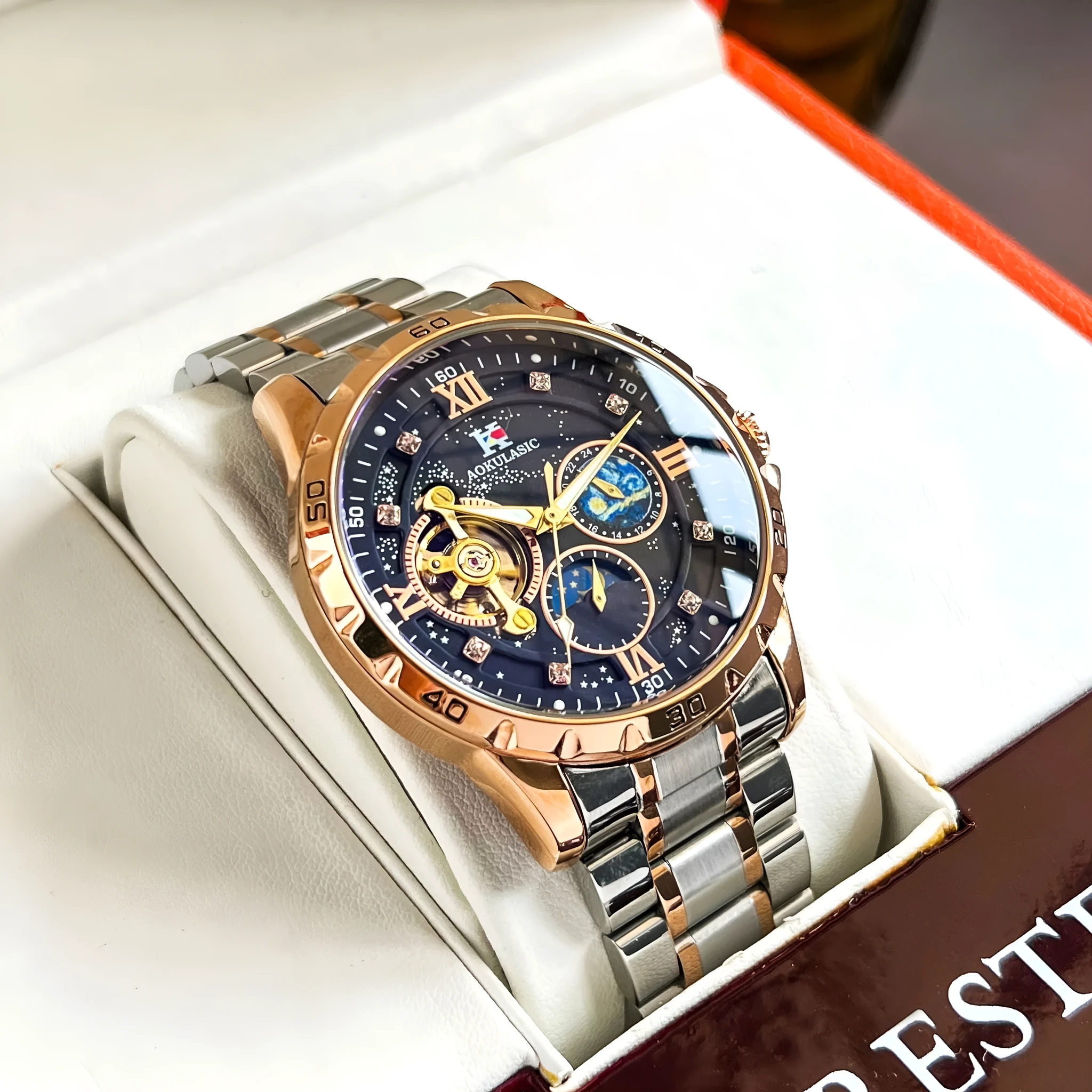 Automatic mechanical men's watch with rose gold shell, black dial, and large multifunctional display.
