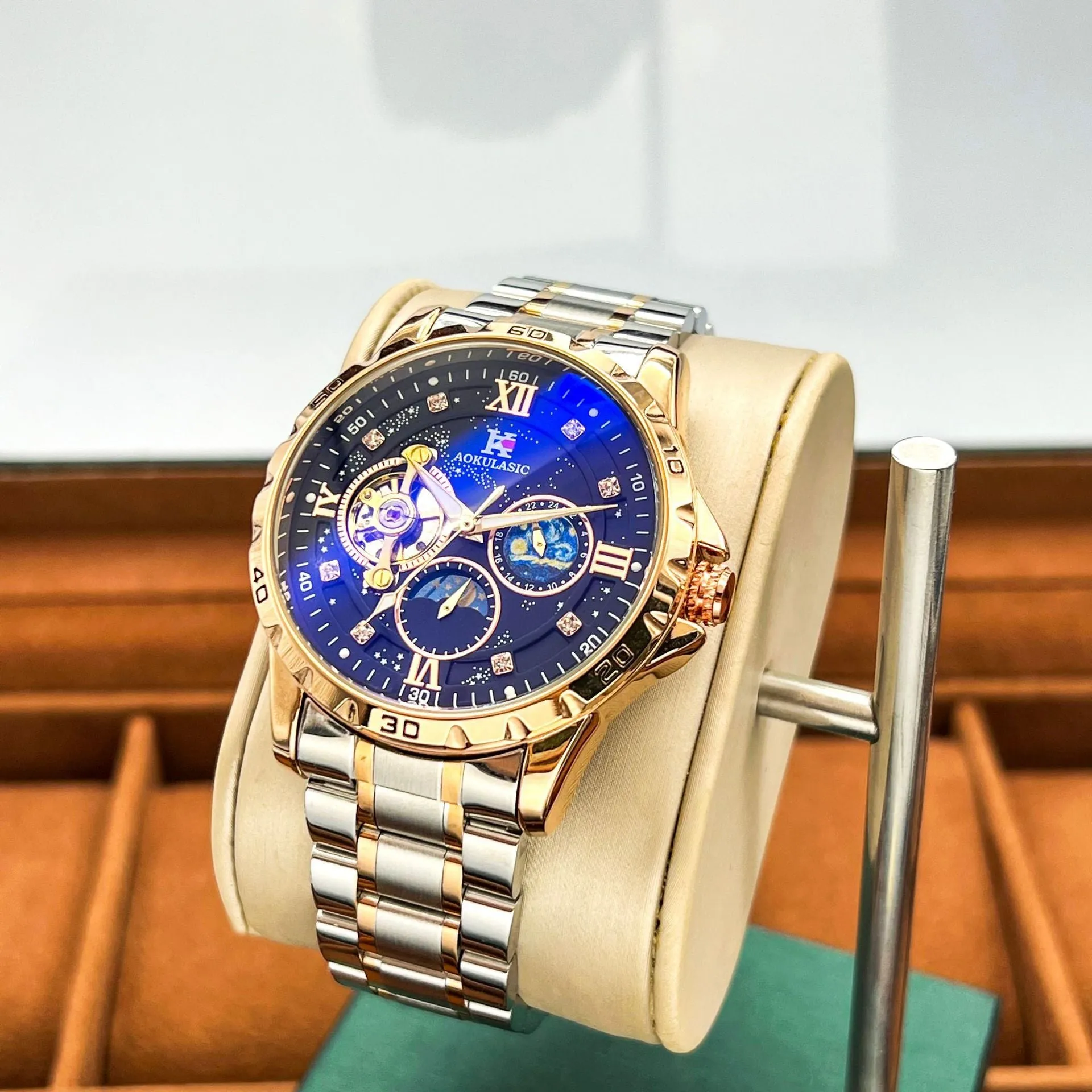Automatic mechanical men's watch with rose gold shell, black dial, and large multifunctional display.