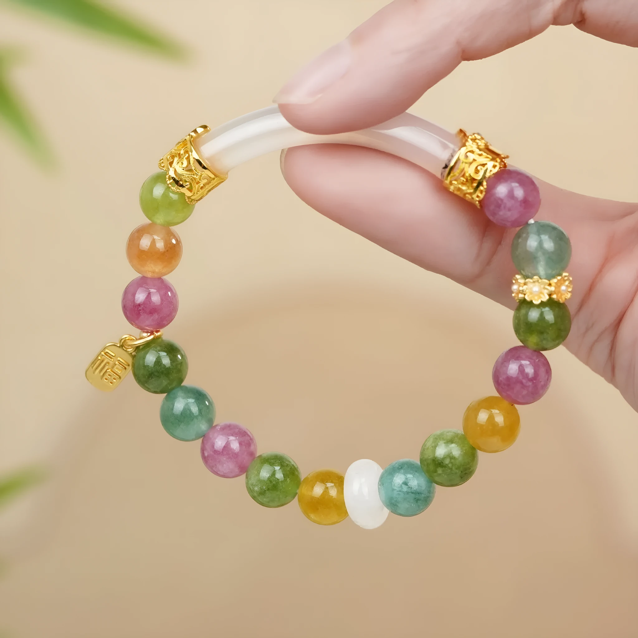 Rainbow coloured tourmaline half bracelet for women with an electroplated finish.