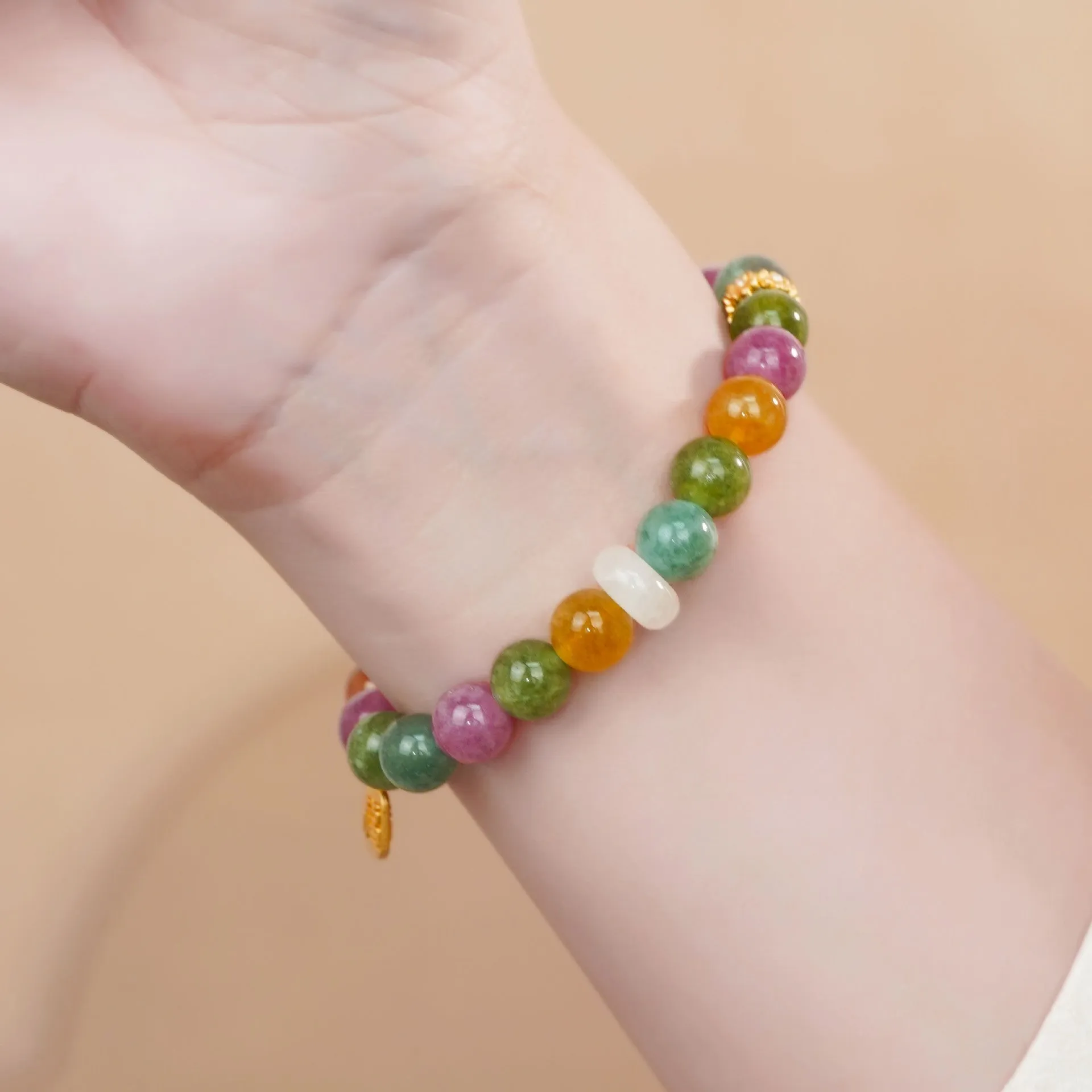 Rainbow coloured tourmaline half bracelet for women with an electroplated finish.