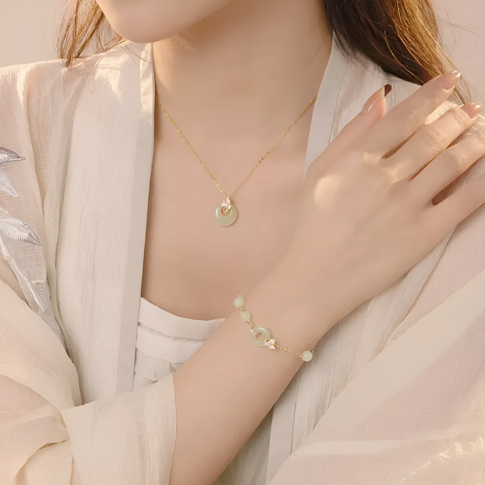 Sterling silver orchid necklace on a model, showing the floral pendant and peace buckle clasp.