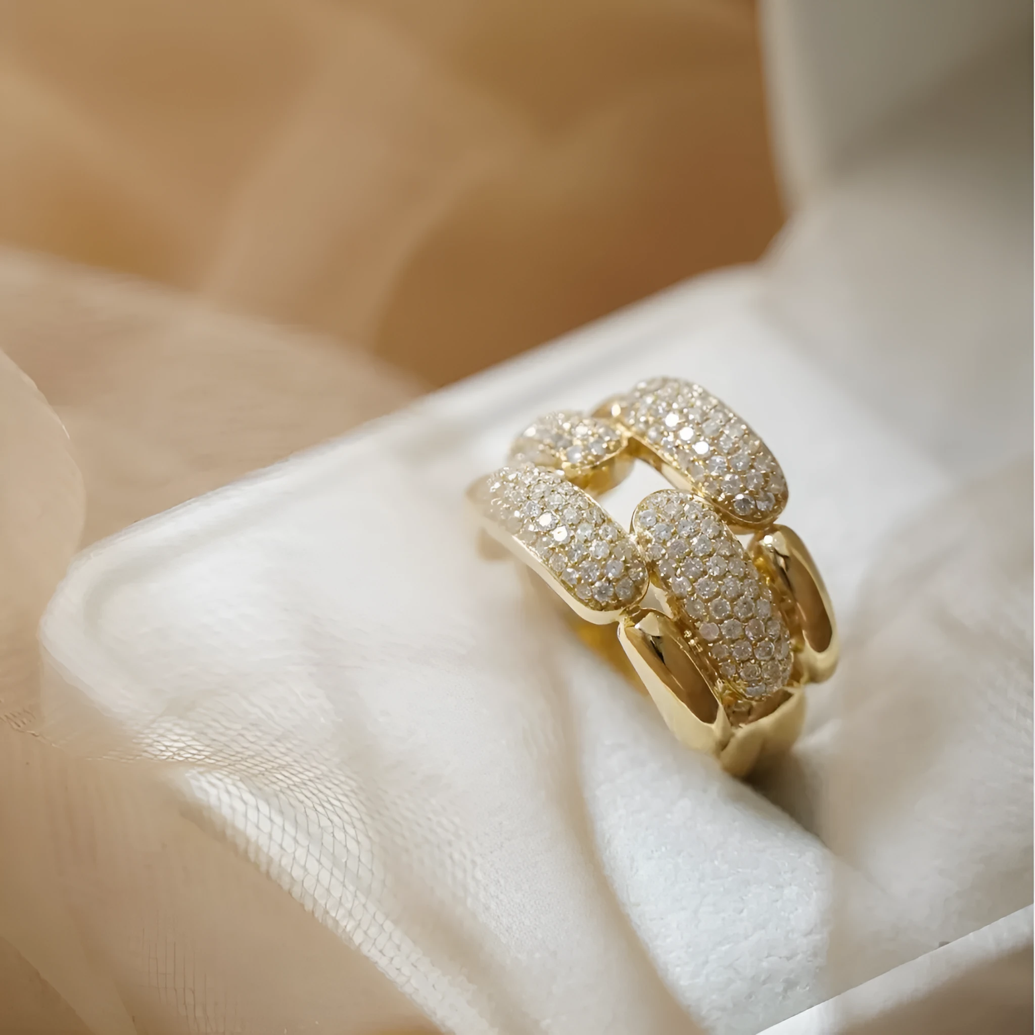 S925 sterling silver geometric ring for women with yellow gold finish and gang drill pattern on pink background