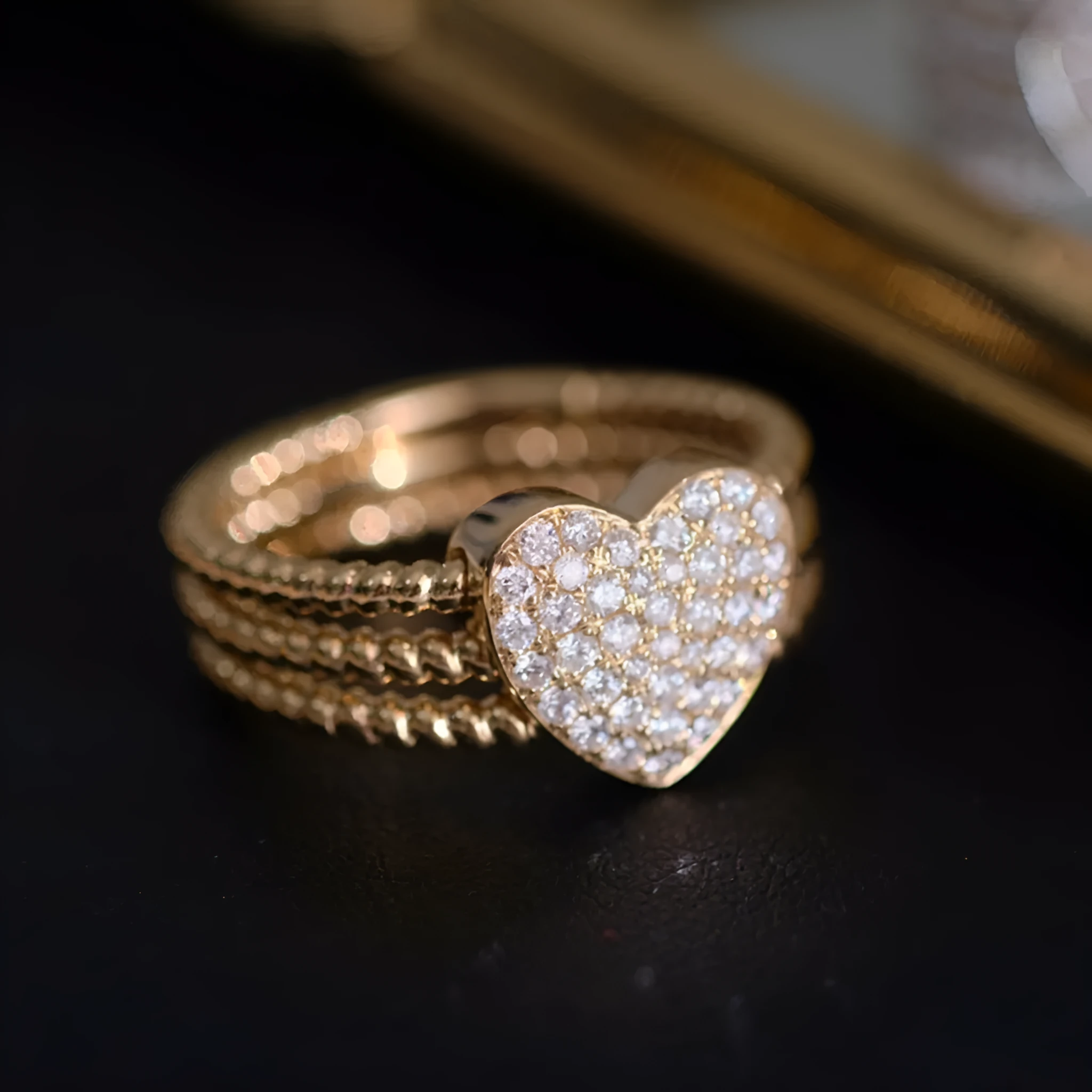 S925 sterling silver ring with heart twist design, available in white gold or yellow gold finish, US sizes 6 to 10