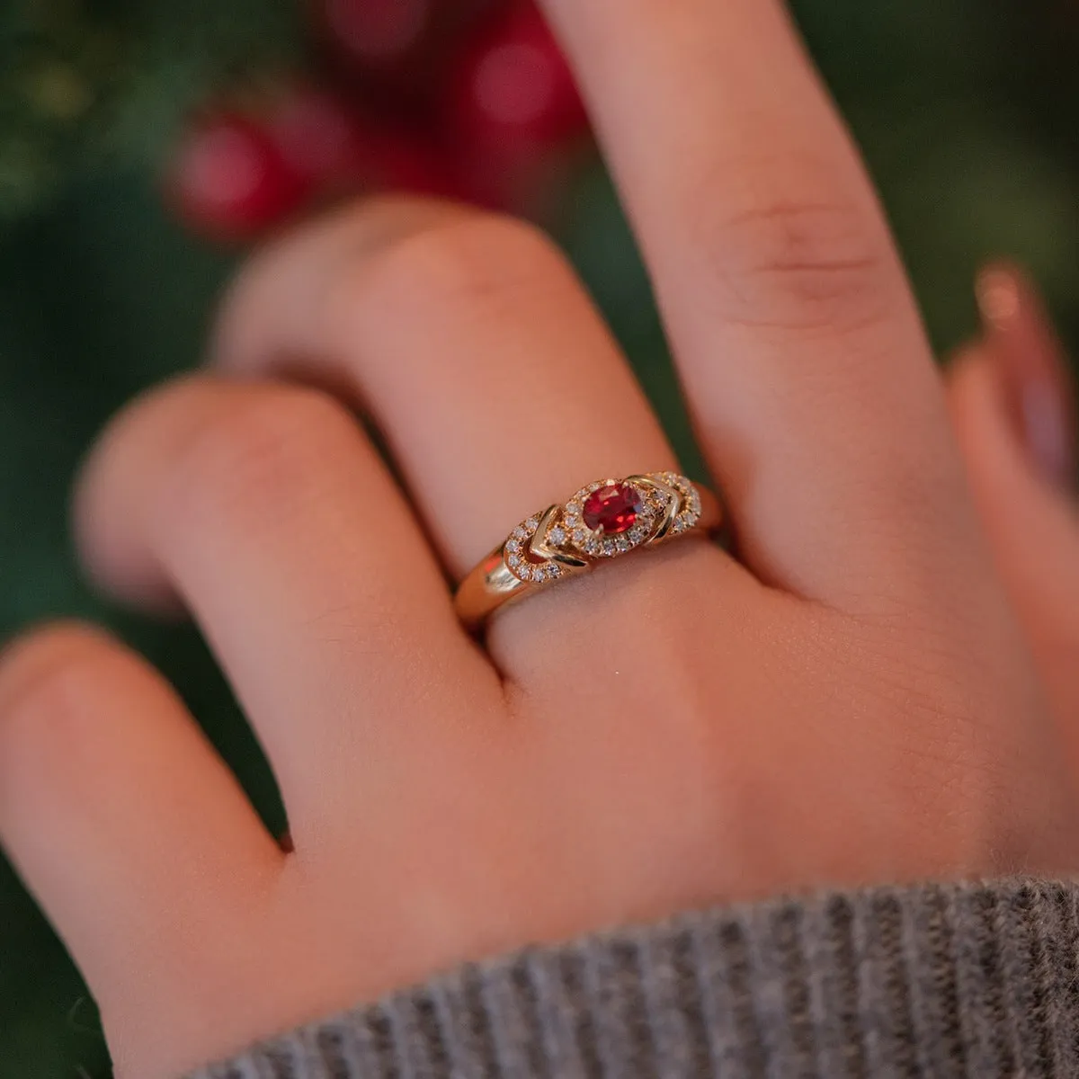 S925 sterling silver ring in yellow gold with geometry shape and diamond treatment on a plain background