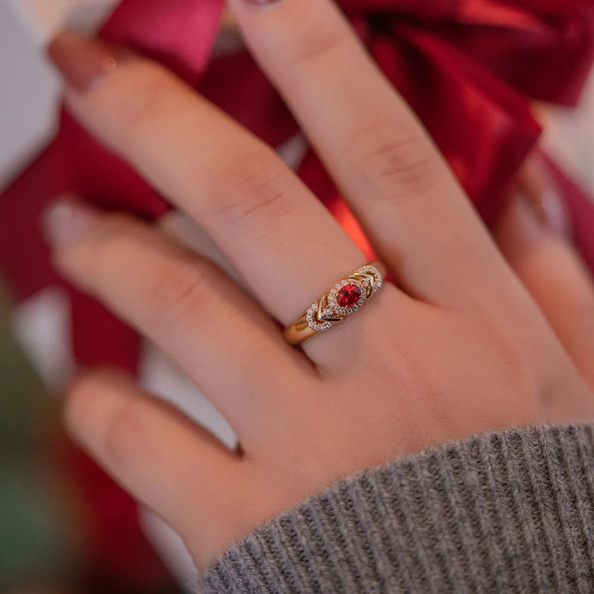 S925 sterling silver ring in yellow gold with geometry shape and diamond treatment on a plain background