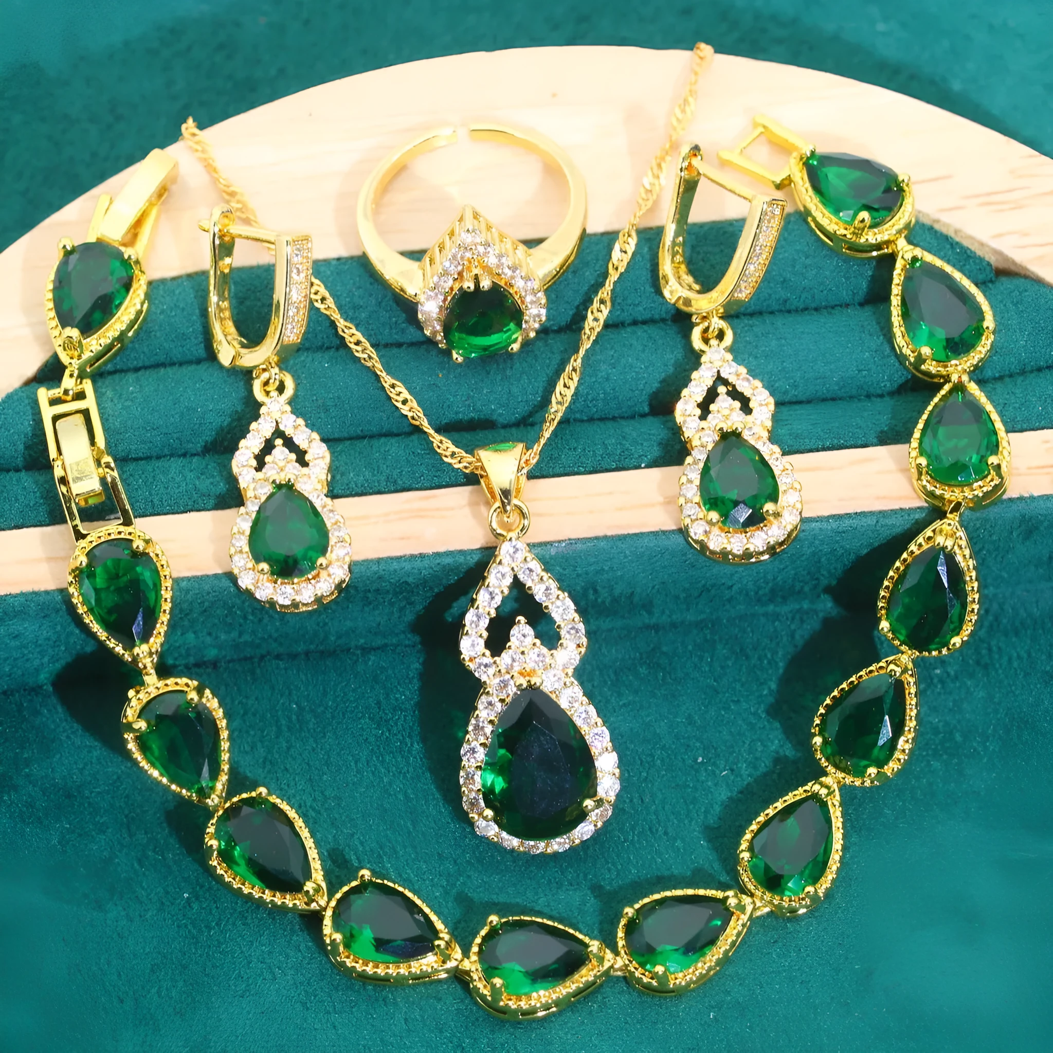 High-end bridal jewelry set with copper inlaid zircon cross and crown pendants in electroplated green and red finish on water wave chain