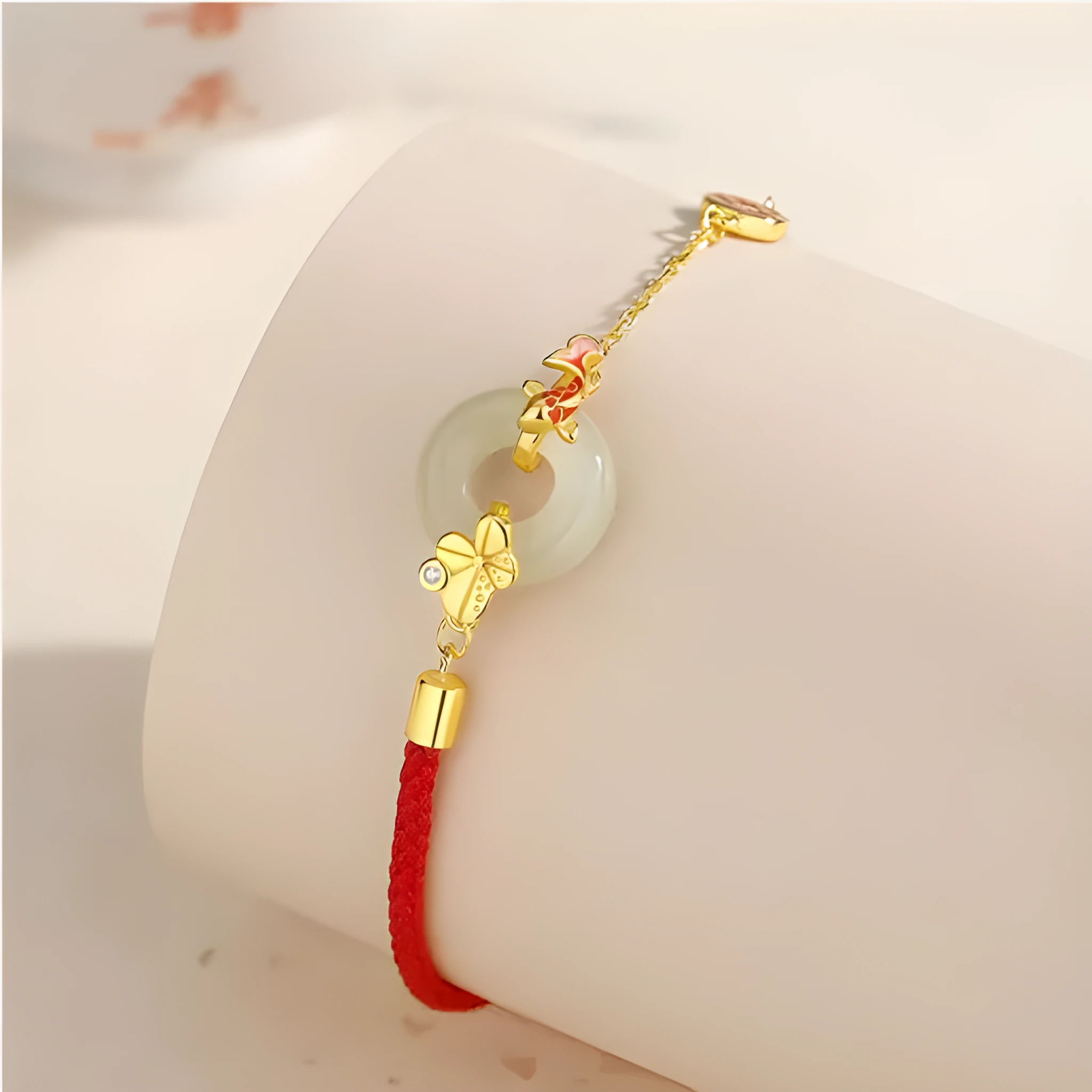 925 sterling silver red rope bracelet with a gold koi peace buckle safety clasp.