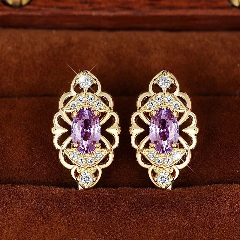 Pair of gold copper earrings with hollow flower design and zircon accents for women