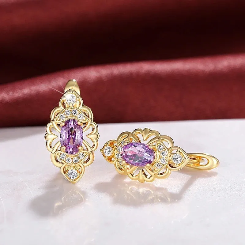 Pair of gold copper earrings with hollow flower design and zircon accents for women