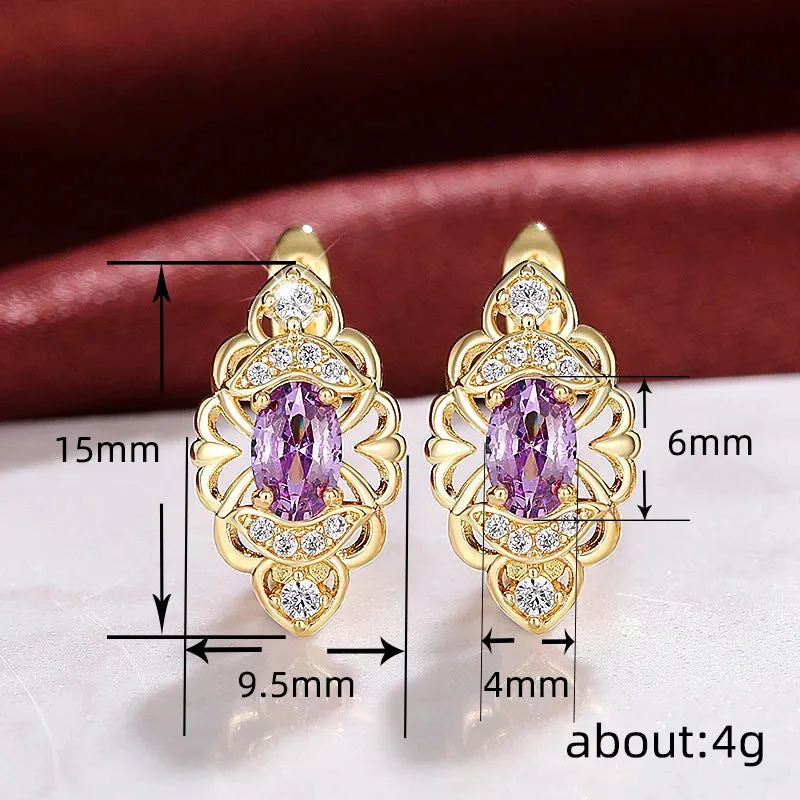 Pair of gold copper earrings with hollow flower design and zircon accents for women