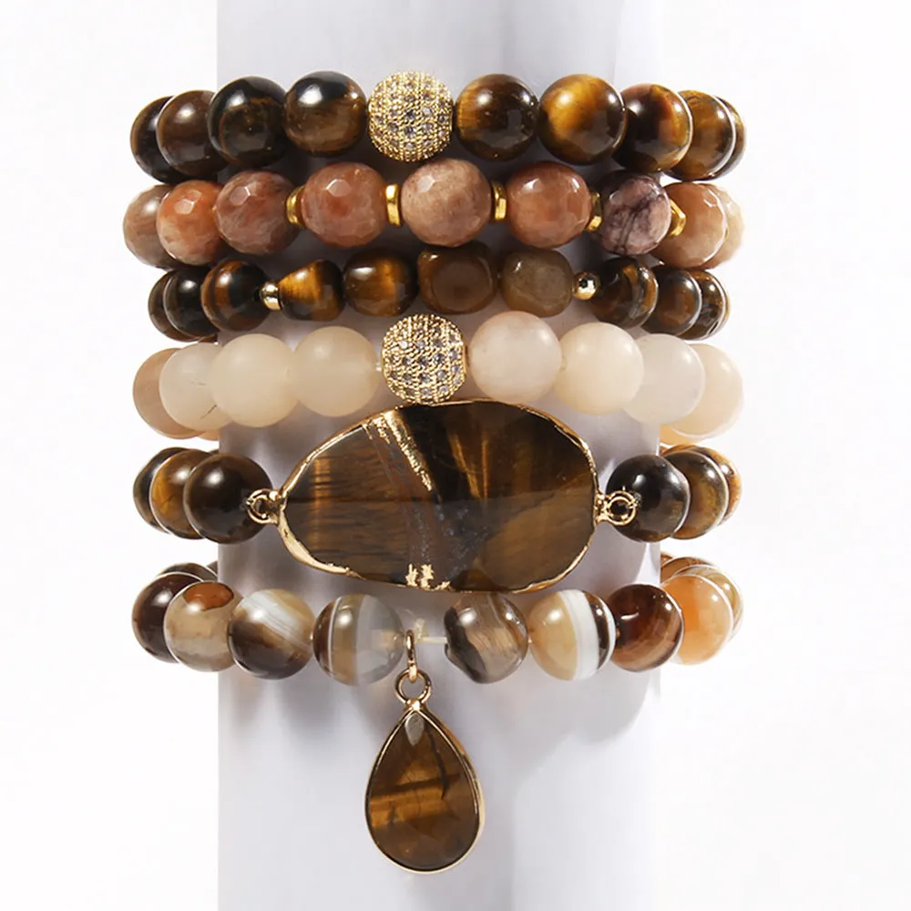 Women's glass beaded stretch bracelet set in brown with natural stone and zircon beads on a white surface