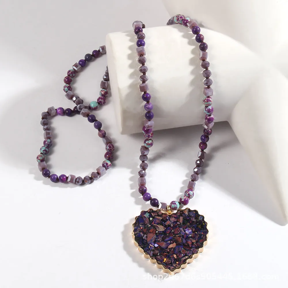 Bohemian style long chain heart pendant necklace in stone and glass with electroplated finish, available in multiple colours.
