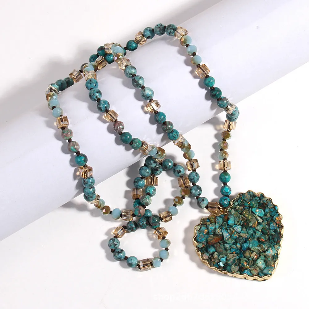 Bohemian style long chain heart pendant necklace in stone and glass with electroplated finish, available in multiple colours.