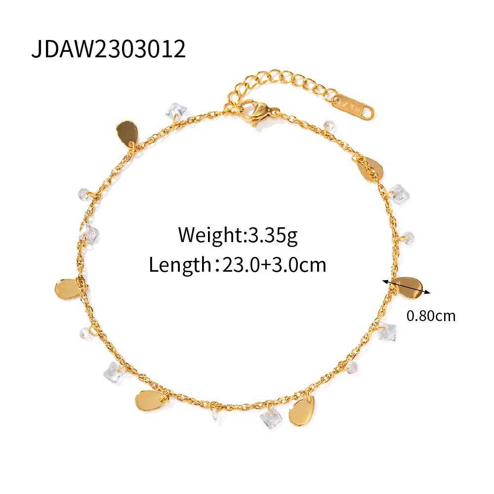 Stainless steel women's anklet with a geometric water drop tassel charm on an ankle.