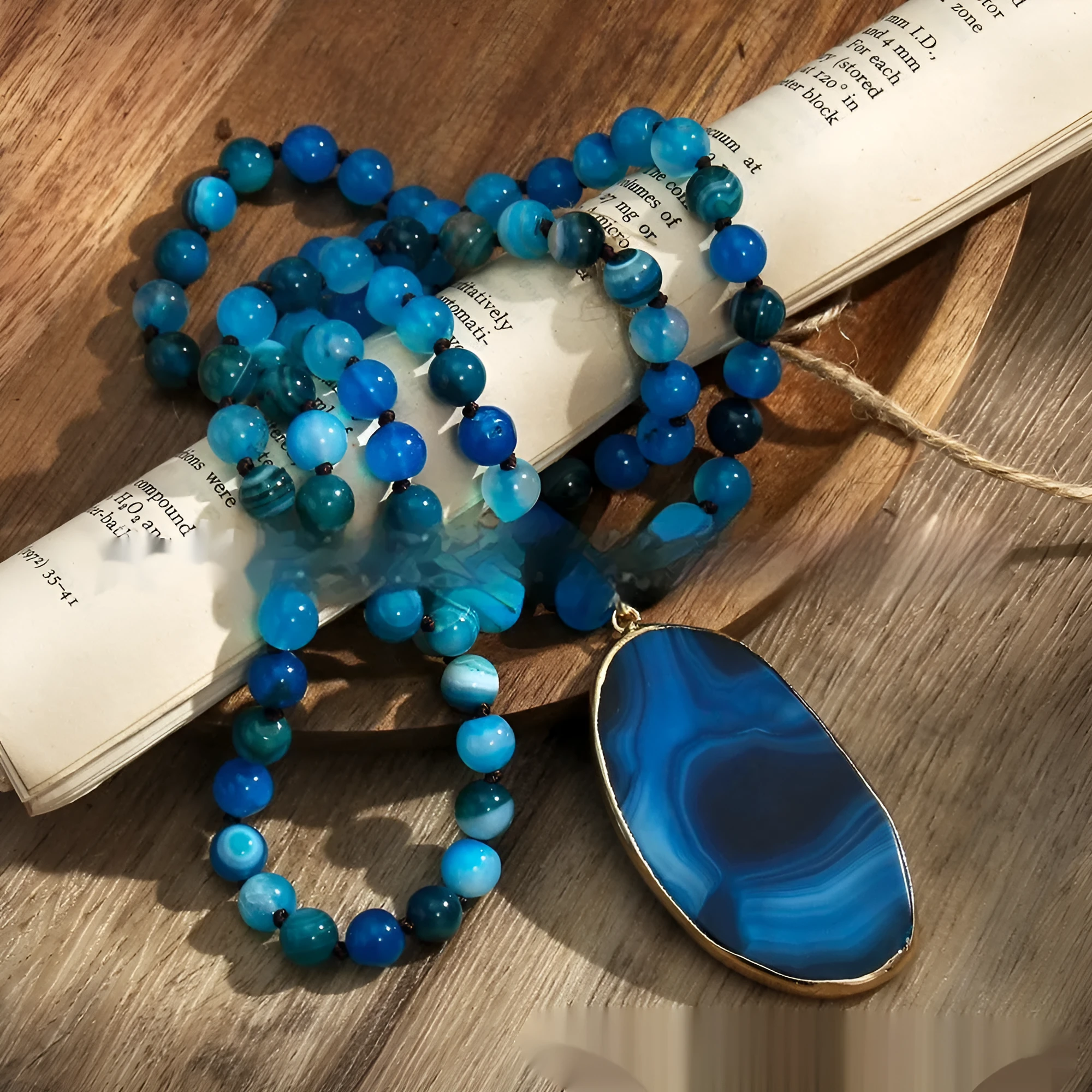 Bohemian handmade necklace with natural stone beads in brown, irregular agate pendant and knotted chain