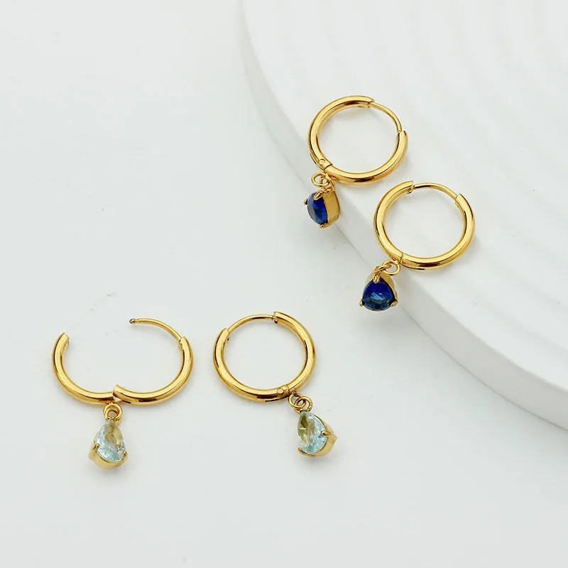 Drop-shaped zircon earrings in seven colours on a woman's earlobe titanium steel geometric design