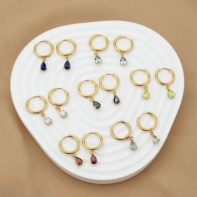 Drop-shaped zircon earrings in seven colours on a woman's earlobe titanium steel geometric design