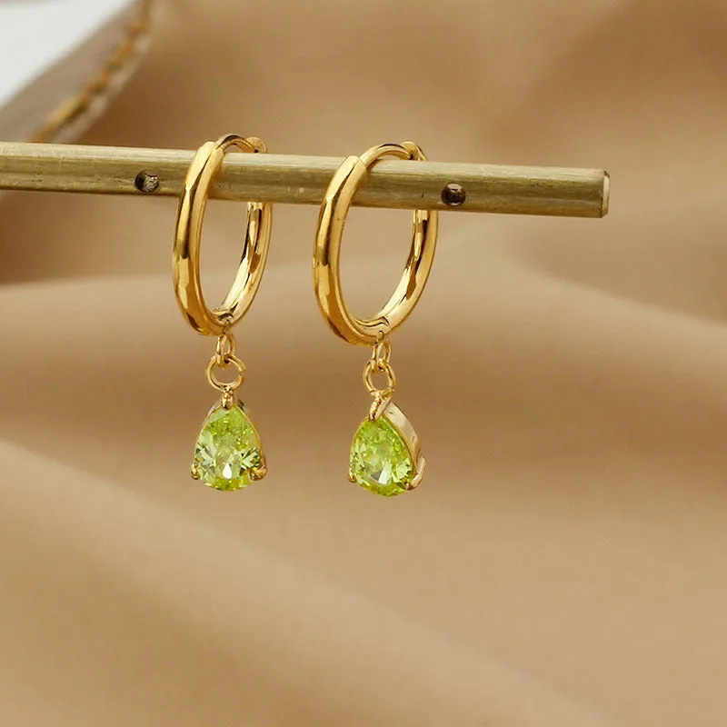 Drop-shaped zircon earrings in seven colours on a woman's earlobe titanium steel geometric design