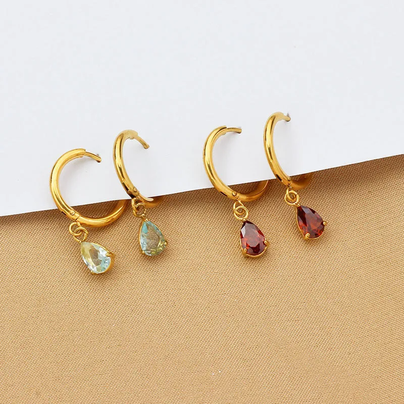 Drop-shaped zircon earrings in seven colours on a woman's earlobe titanium steel geometric design