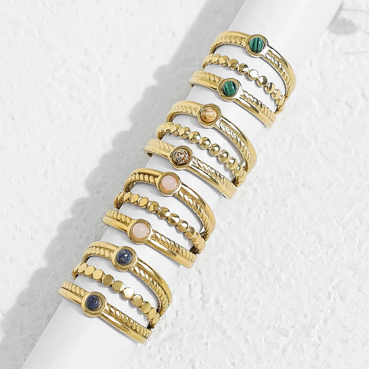Natural stone multi-layer adjustable stainless steel ring with gold plating, geometric shape, and twist design in pink colour