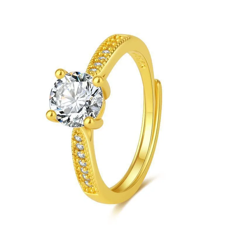 Classic four-claw ring with 1 karat eight hearts eight arrows zircon in gold colour on white background